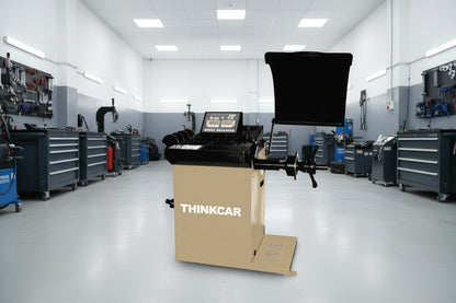 Balanceadora automática THINKCAR TWB 611 con láser y bloqueo electromagnético instalada en taller automotriz profesional